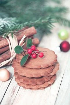 Stack of traditional gingerbread biscuits with various spices placed on white 스톡 사진