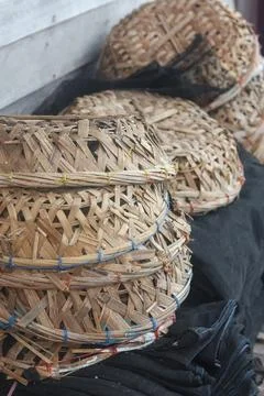 Stack of traditional handcrafted bamboo baskets used for fishing and agricul Stock Photos