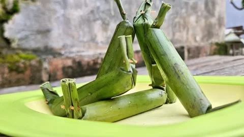 Stack of Traditional Indonesian Lontong Rice Cakes Wrapped Video stock 333754657