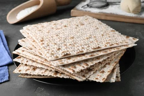 Stack of traditional matzos on grey table 스톡 사진