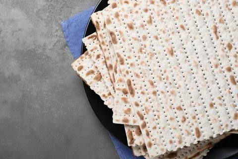 Stack of traditional matzos on grey table, flat lay Stock Photos