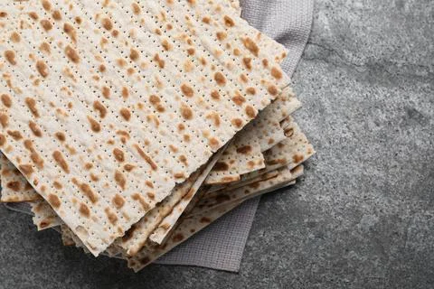 Stack of traditional matzos on grey table, above view 스톡 사진