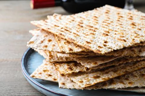 Stack of traditional matzos on wooden table, closeup 스톡 사진