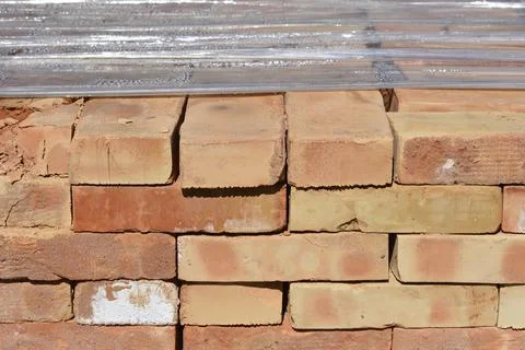 Stack of Traditional Red and Yellow Clay Bricks 写真素材