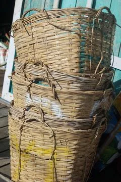 Stack of Traditional Woven Bamboo Baskets for Fish Harvests Stockfoto's