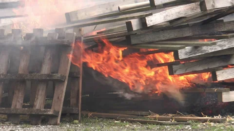 Stack of transport pallets burning Stock Footage 29668950