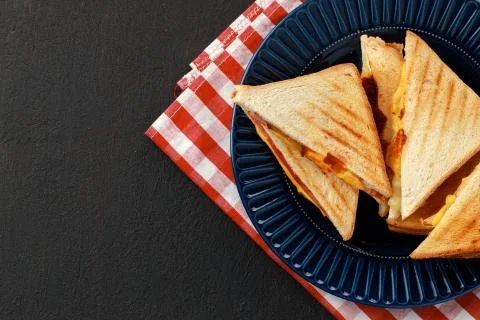 Stack of triangle sandwiches in plate close up Stock Photos