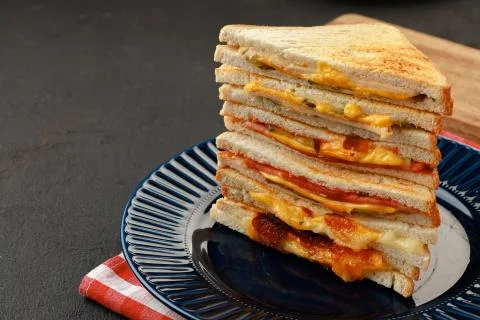 Stack of triangle sandwiches in plate close up Stock Photos