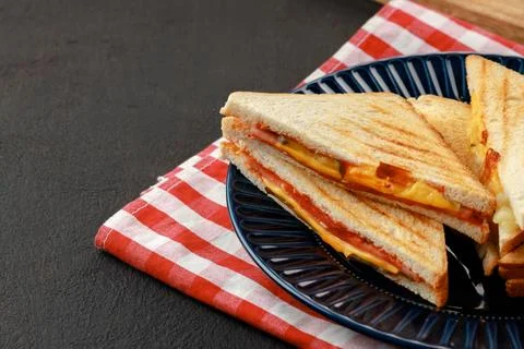 Stack of triangle sandwiches in plate close up Stock Photos