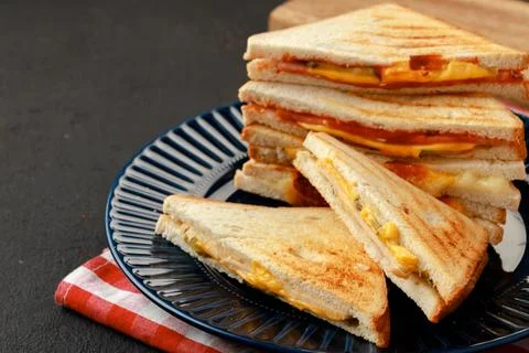 Stack of triangle sandwiches in plate close up Stock Photos