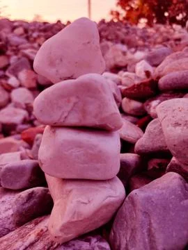 Stack of triangular stones.Group of white and colorful Stones.Pebble tower on Stock Photos