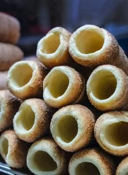 Stack of trndeliki close-up sprinkled with sugar and cinnamon Stock Photos