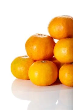 Stack of tropical tangerines, isolated on white with clipping path. Stock-Fotos