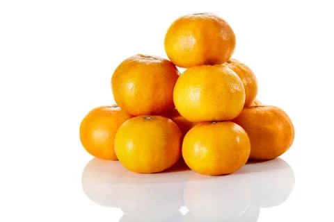 Stack of tropical tangerines, isolated on white with clipping path. Stock-Fotos