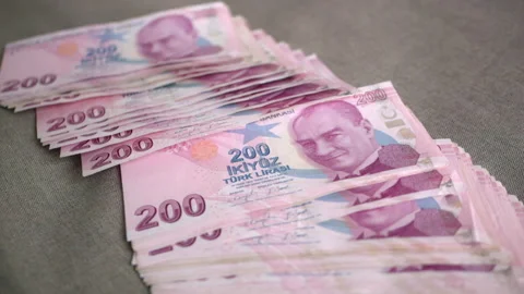 A stack of Turkish lira banknotes with a denomination of two hundred lira is Stock Footage 222451210