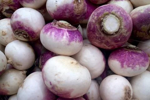 Stack of turnips on a market stall 스톡 사진
