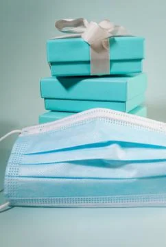 Stack of turquoise blue boxes, one tied with white silk ribbon Stock Photos