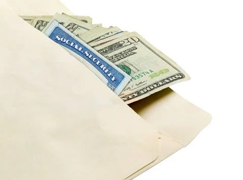 Stack of twenty dollar bills in envelope with social security card Stack o... Stockfoto's