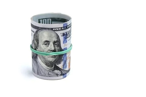 A stack of twisted roll of one hundred dollar bills tied with a green bank ru Stock Photos