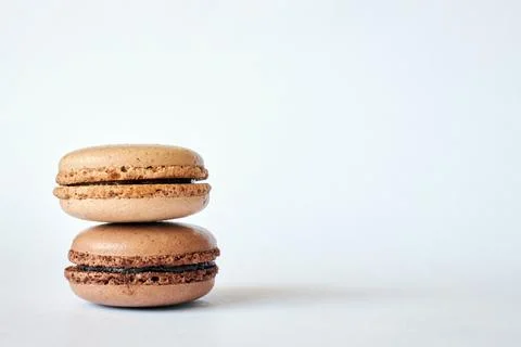Stack of two brown French Macarons, cakes with coffee and creme brulee flavor 写真素材