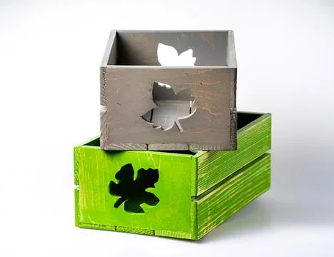 Stack of two colorful wooden tissue boxes with cutouts Stock Photos