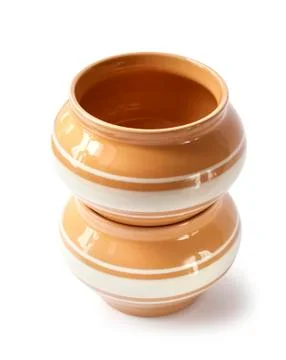 Stack of two glazed ceramic pots for cooking on a white background Stock Photos