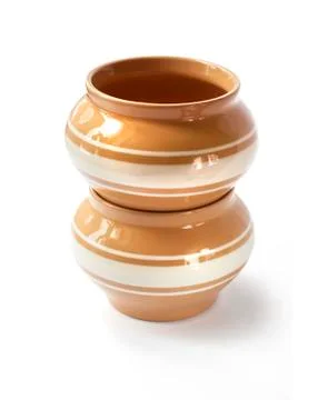 Stack of twoo glazed ceramic pots for cooking on a white background with clip Stock Photos