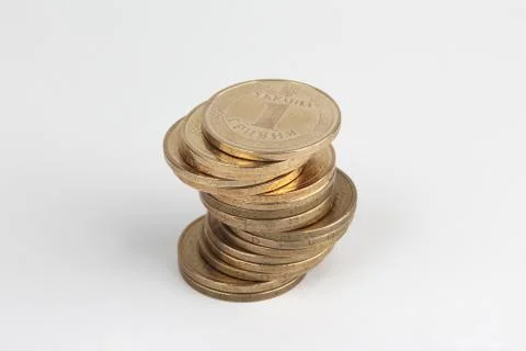 Stack of Ukrainian coins on the white background Stock Photos
