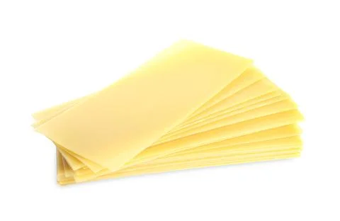 Stack of uncooked lasagna sheets isolated on white Foto stock