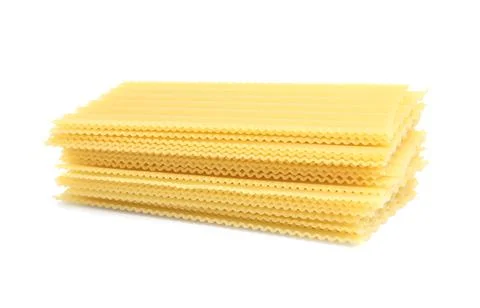 Stack of uncooked lasagna sheets isolated on white Foto stock