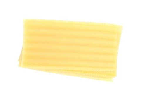 Stack of uncooked lasagna sheets isolated on white, top view 写真素材