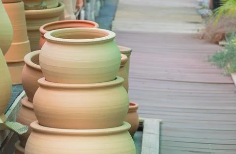 Stack of unglazed terracotta clay pots for sale Stock Photos