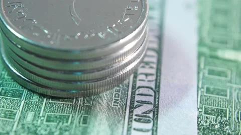 Stack of United Arab Emirates coins against the background of US hundred doll Video stock 157367375