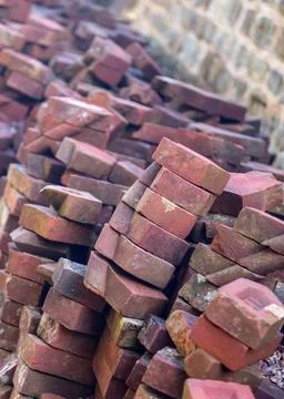 Stack of unusual shaped hand made bricks Old hand made bricks in pile stac... 写真素材