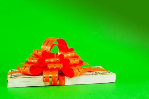 Stack of us 100 dollar bills tied up with a ribbon Stock Photos