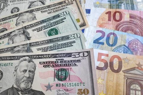 Stack of US Dollar and Euros Stock Photos