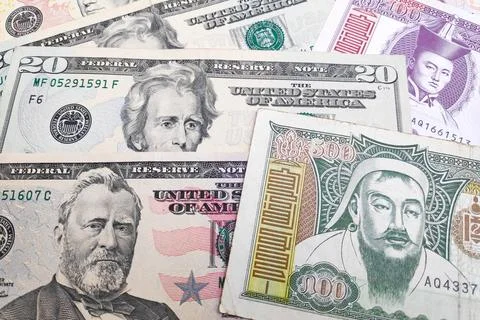 Stack of US Dollar and Mongolian Togrog Stock Photos