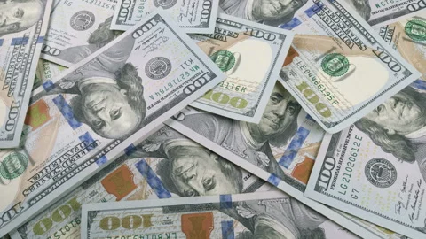 A Stack of U.S. Dollar Bills Carefully Arranged in a Neat Pile for Viewing and H Stock Footage 303574933
