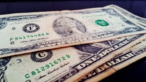 Stack of US dollar bills on dark surface. Financial success and cash flow Stock Footage 340480629