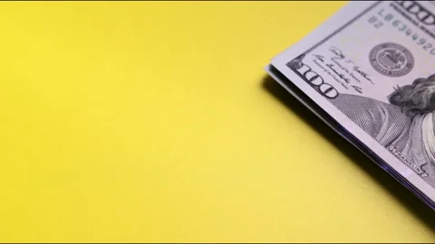 Stack of US dollar bills on table Vídeos de archivo 148324970