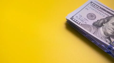 Stack of US dollar bills on table 스톡 사진