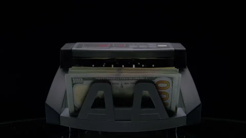 Stack of US Dollars in Money Counter Stock Footage 334838524