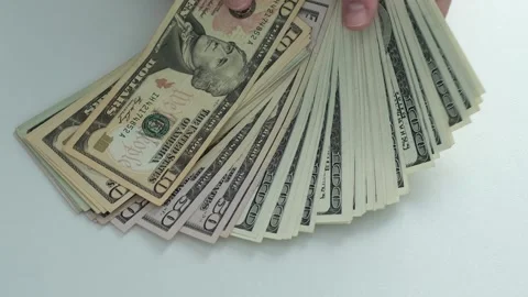 A stack of US dollars. The top of the stack is a 20 bill. Stock Footage 314112808