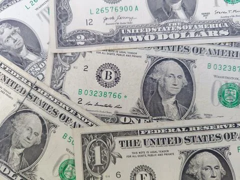 Stack of US One and Two dollar bills. US banknotes. Top view. Business concept. Stock Photos