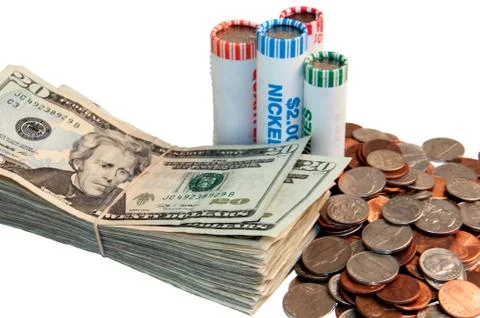 Stack of usa currency and rolls of coins Stock Photos