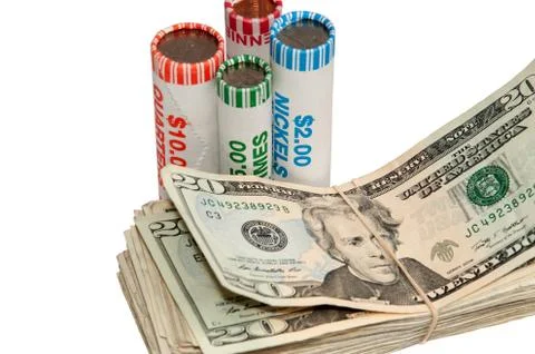 Stack of usa currency and rolls of coins Stock Photos