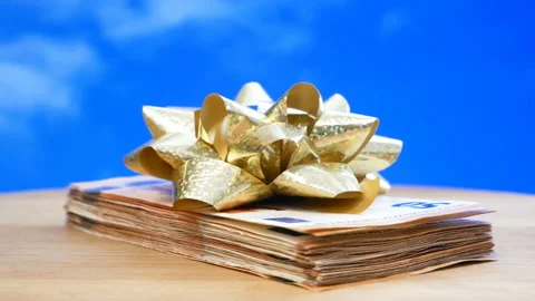 Stack of usa dollars and bow, money gift concept, rotation Stock Footage 153890773