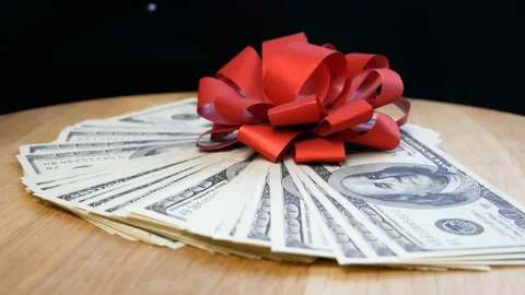 Stack of usa dollars and bow, money gift concept, rotation Stock Footage 153890852