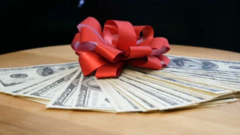 Stack of usa dollars and bow, money gift concept, rotation Stock Footage 153890880