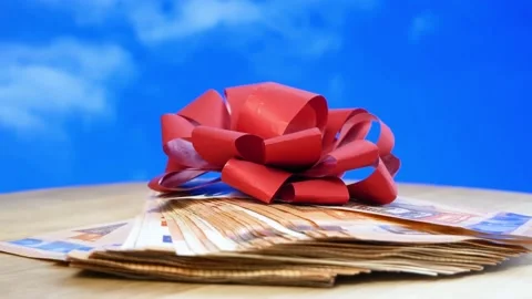 Stack of usa dollars and bow on blue  background, money gift concept Stock Footage 164478710